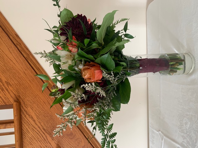 Peach rose and red mum bouquet