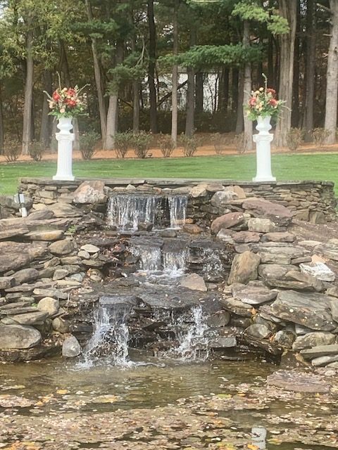 Ceremony arrangements displayed on pillars