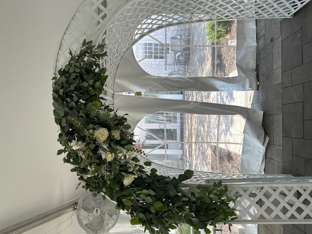 Greenery and white rose arbor swag