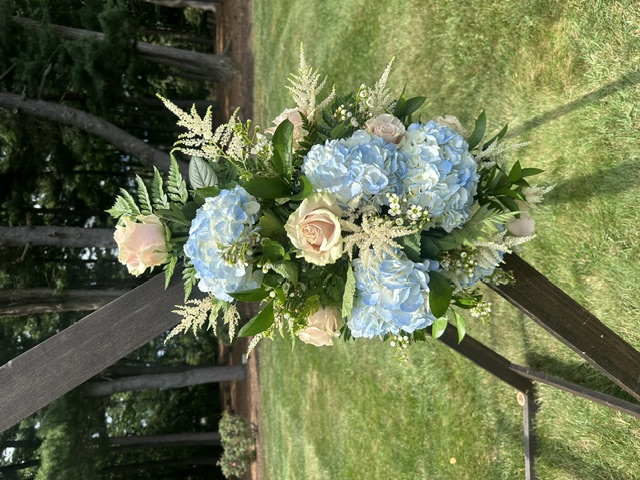 Light blue hydrangea and pink rose arbor swag