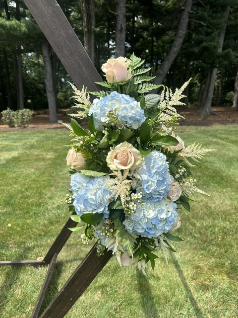 Light blue hydrangea and pink rose arbor swag