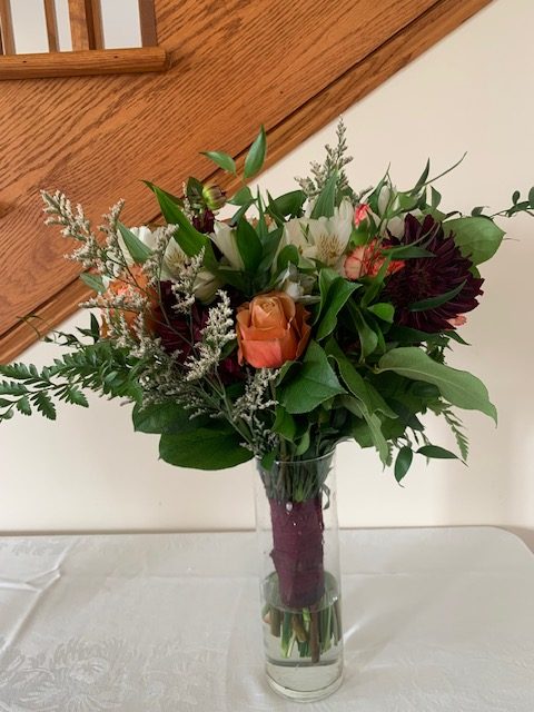 Peach rose and red mum bouquet