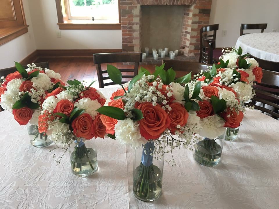 Pink and white rose bridesmaid bouquets with baby's breath