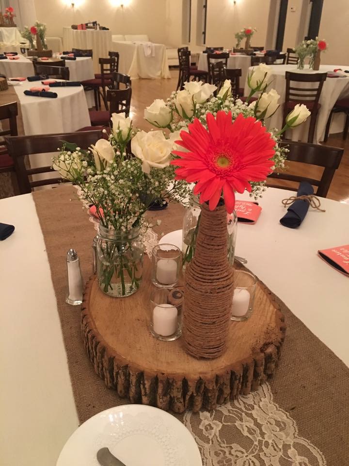 Pink gerbera daisy and white rose centerpiece