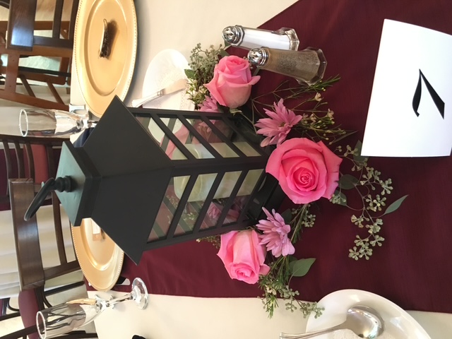 Loose pink roses arranged for a centerpiece