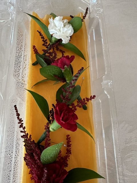 Red mini carnation and red astilbe boutonnieres