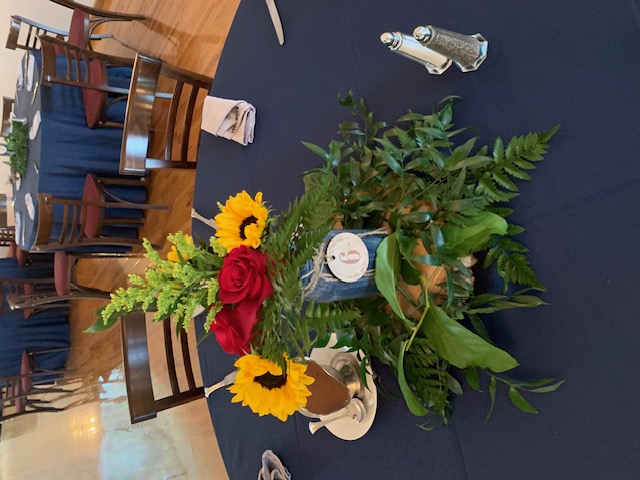 Sunflower and red rose centerpiece