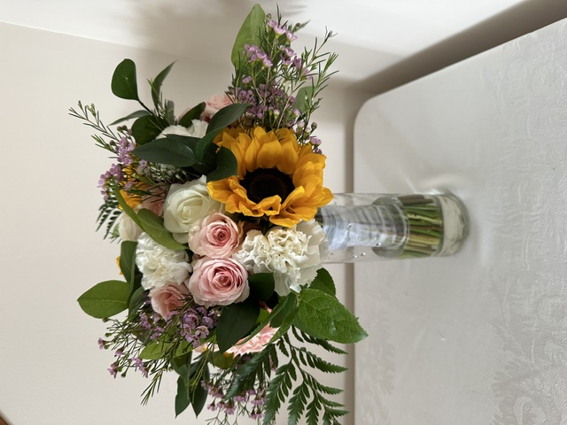 Sunflower, pink rose, and white hydrangea bouquet