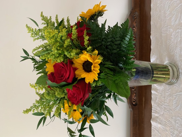 Sunflower, red rose, and solidago bouquet