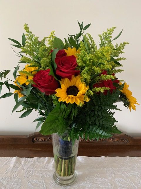 Sunflower, red rose, and solidago bouquet
