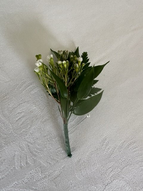 Wax flower and greenery boutonniere