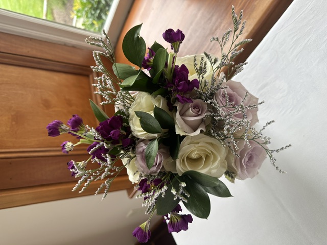 White and purple rose, astilbe, and mini carnation bouquet