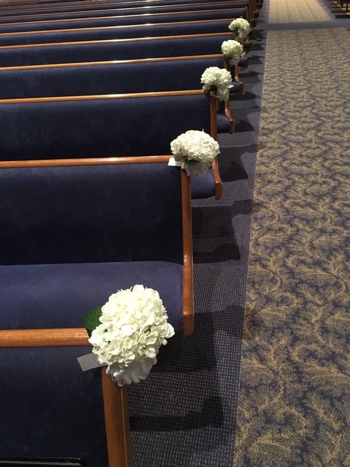 White hydrangea church aisle decorations