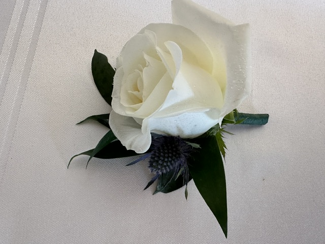 White rose and thistle boutonniere