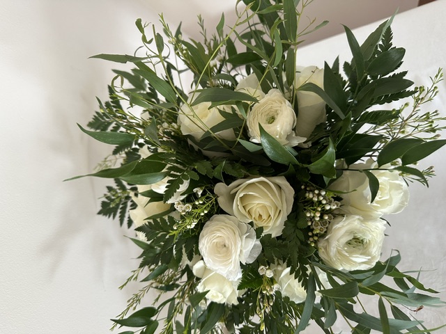 White rose, white ranunculus, and greenery bouquet