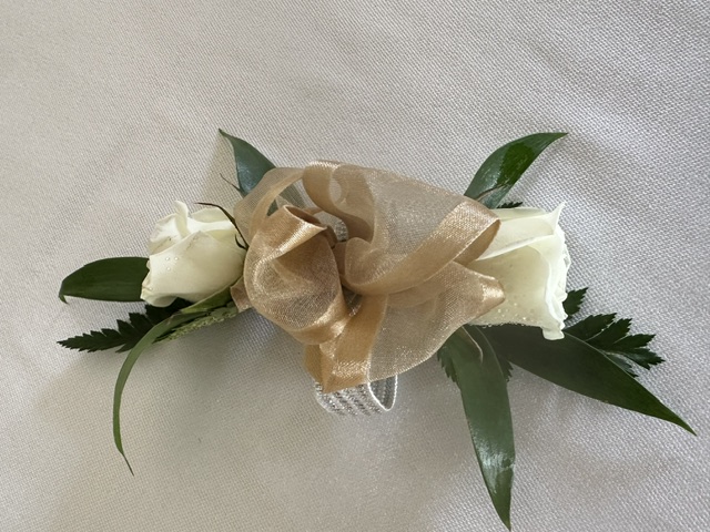 White sweetheart rose corsage with gold ribbon