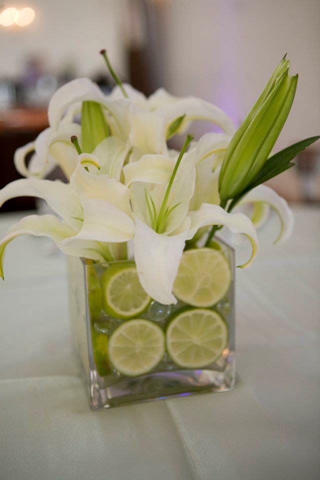 White lily centerpiece with lime accents
