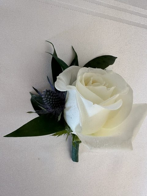 White rose and thistle boutonniere