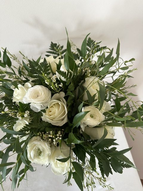 White rose, white ranunculus, and greenery bouquet